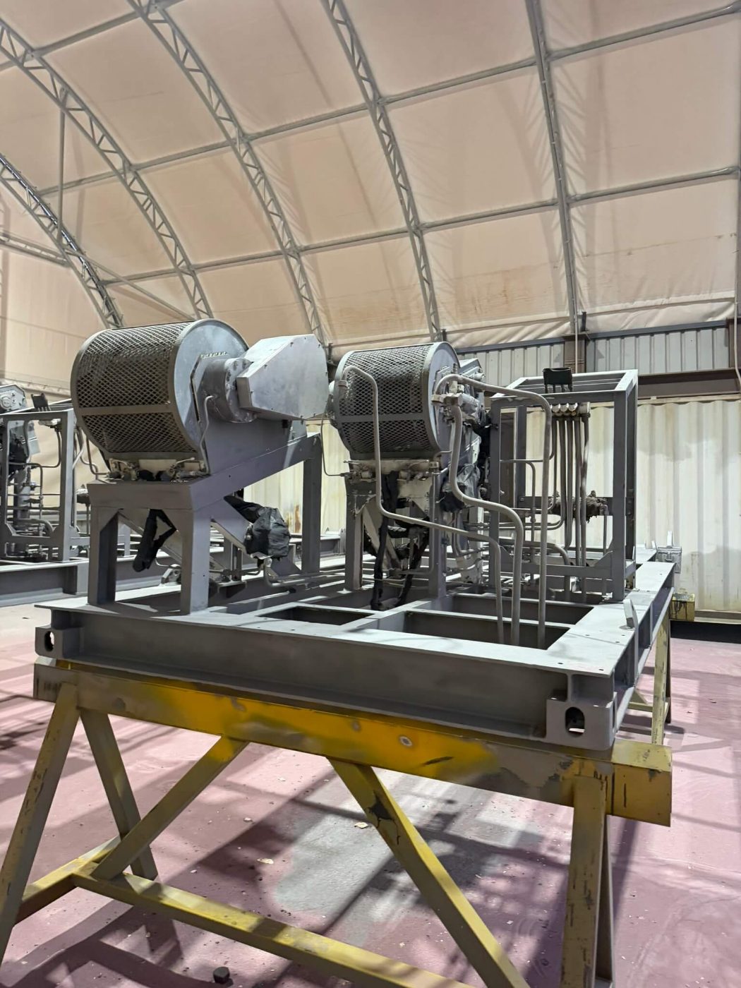 The same plant skid blasted back and primed in grey, base frame and drum housings included