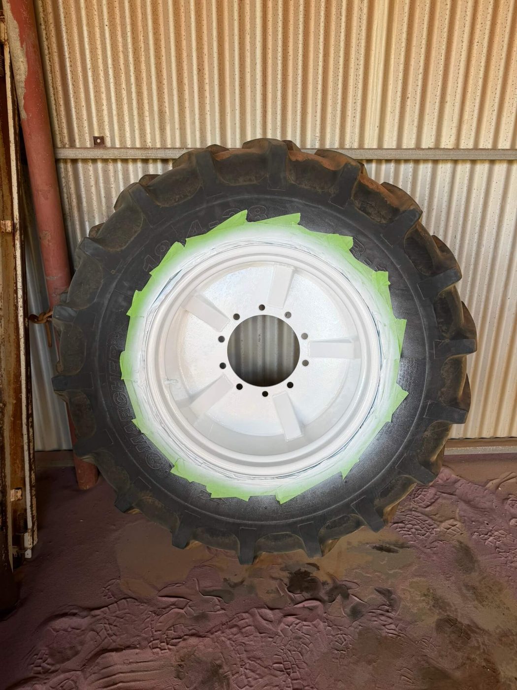 The same tractor rim blasted and finished in white with the tyre masked off