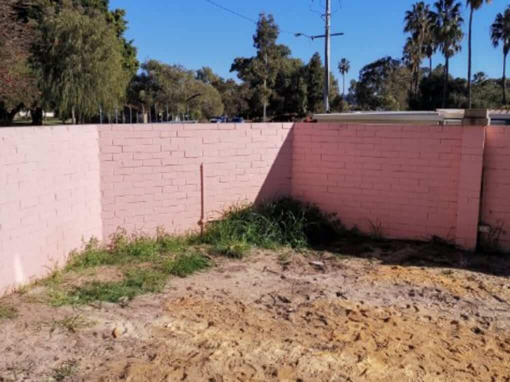 Painted brick wall in Perth before dustless blasting