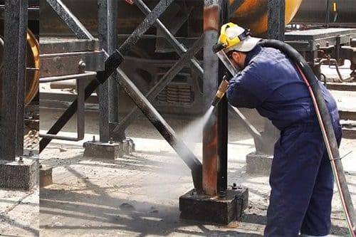 Structural steel column blasted at the base on a refinery site