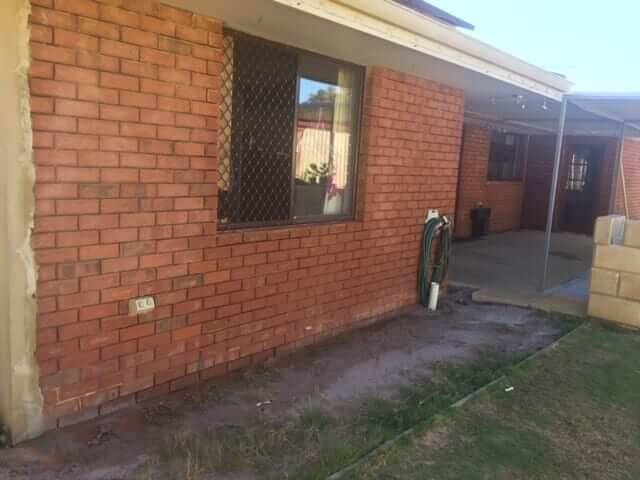 Red brick house wall in Perth restored after paint removal