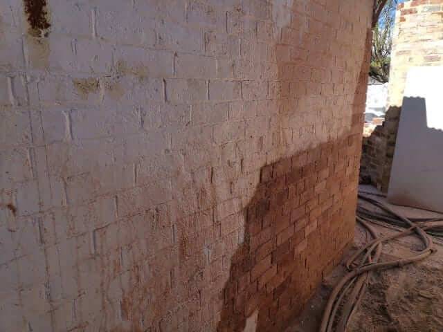 Restored brick wall showing original face brick colour returned
