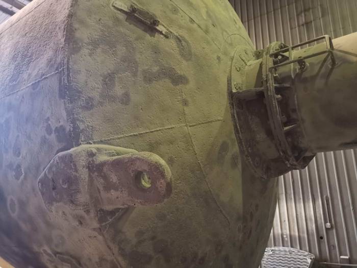 Deep water pillar buoy caked in marine growth before blasting
