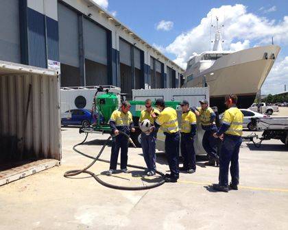 Dustless Blasting Services operator blasting a trailer chassis