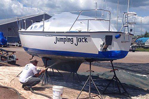 Marine vessel hull blasted back to steel in dry dock