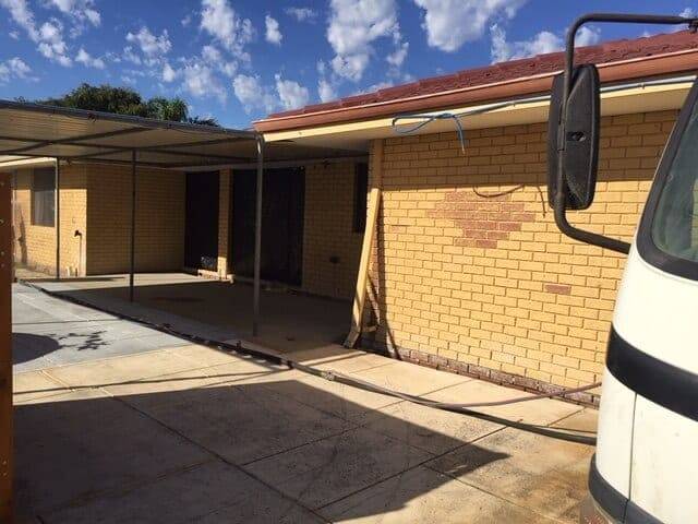 Painted brick wall photographed before dustless blasting begins