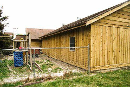 The same timber shed stripped back to clean pale cladding