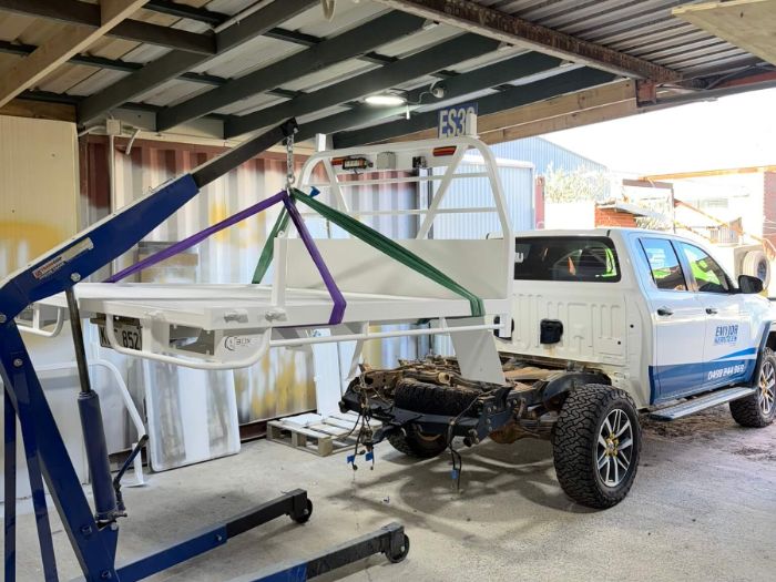 Freshly coated ute tray and canopy craned off the chassis in our Perth workshop