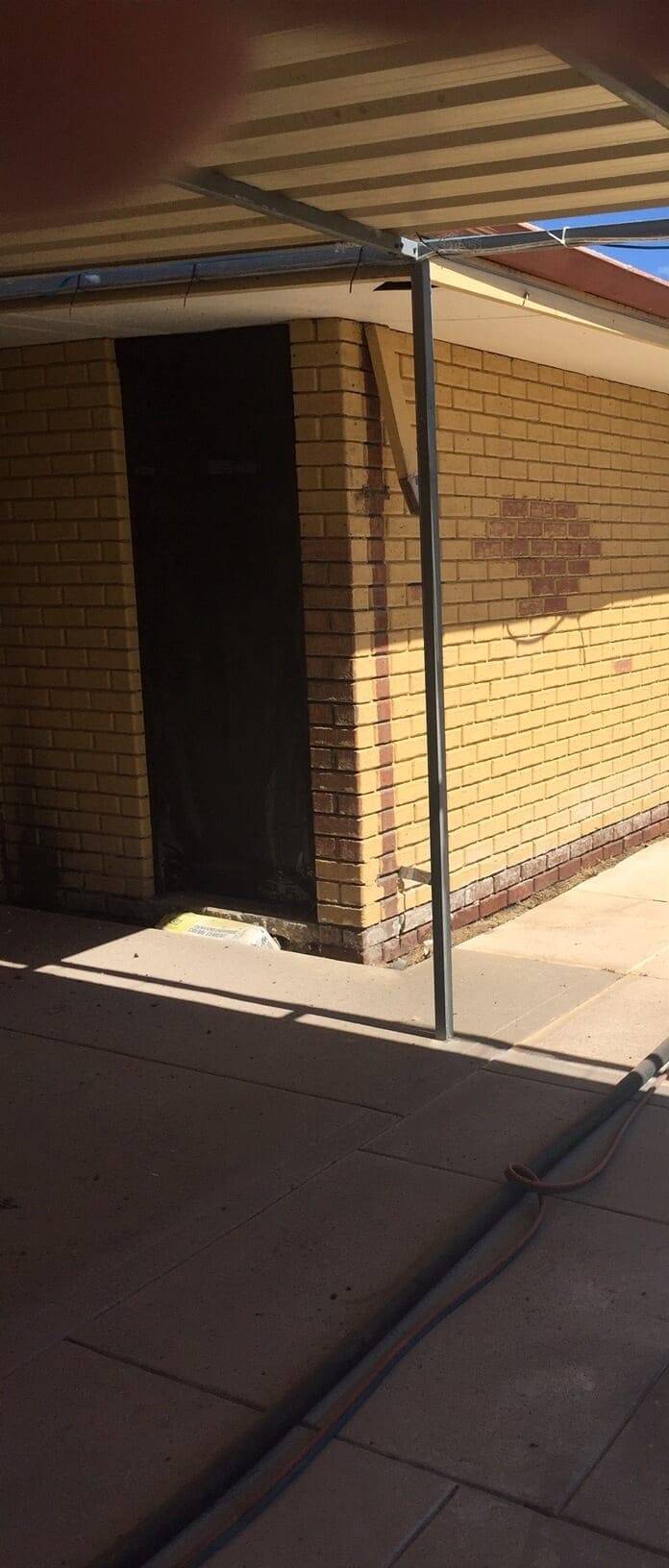 Painted warehouse brick wall stripped back inside a Perth building