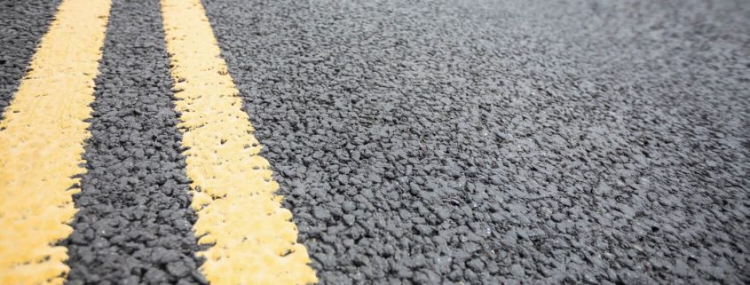 Line Marking Removal - Dustless Blasting removes yellow lines from Asphalt road